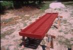 Underside of deck of greenhouse bench under construction